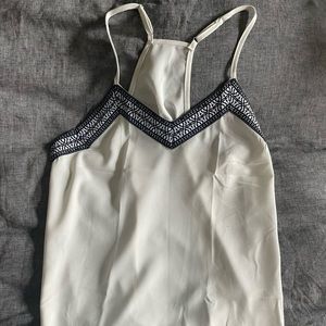 White razor back tank with black embroidery